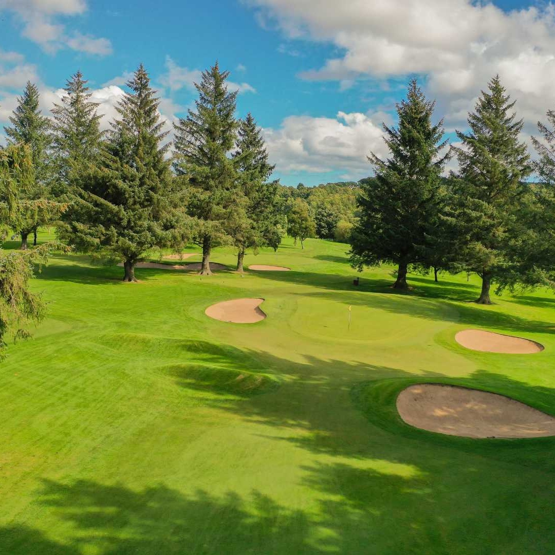 Aerial view of bunkers and mature trees on the Blairs 9-hole golf course, Aberdeen