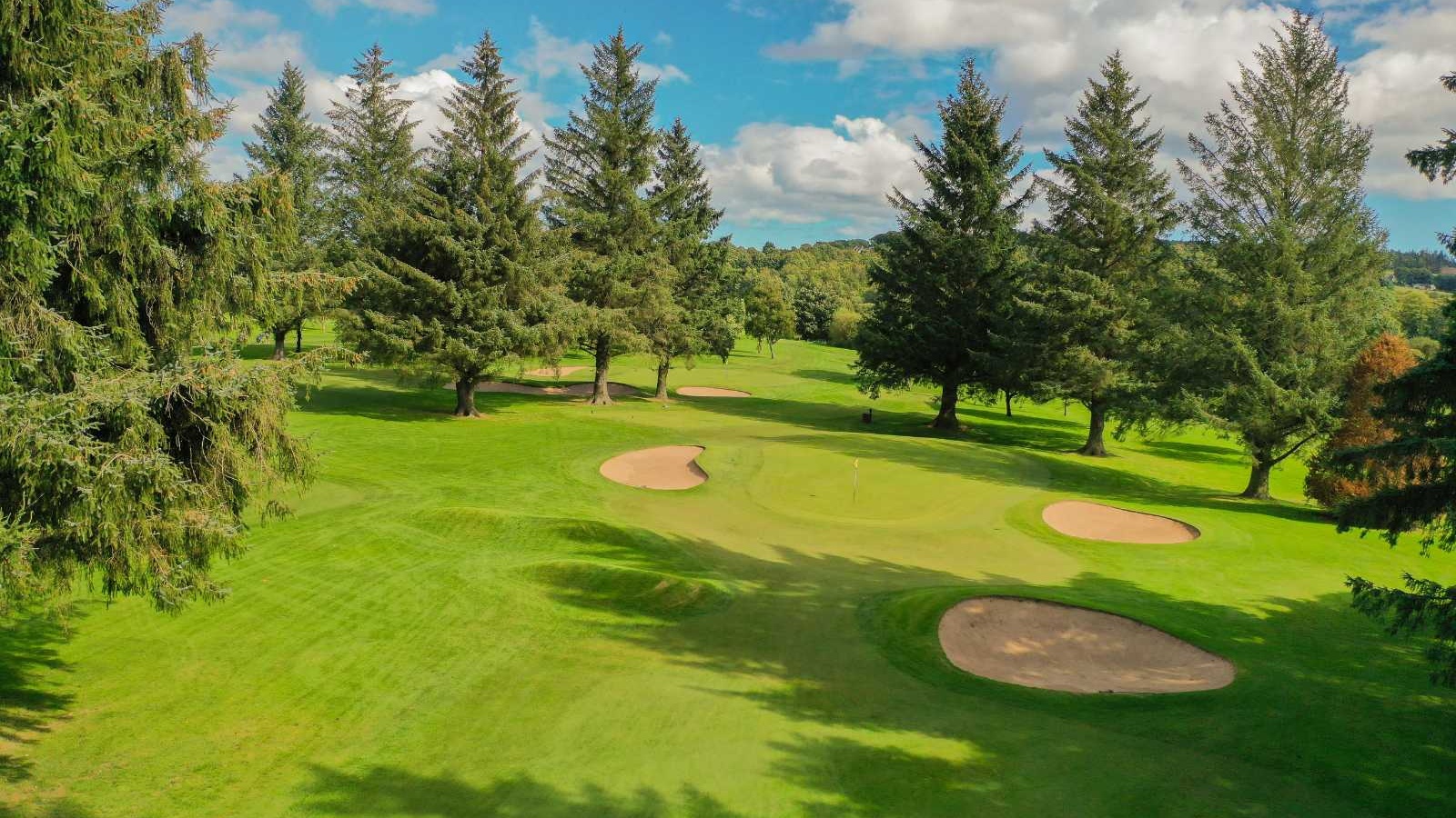 Aerial view of bunkers and mature trees on the Blairs 9-hole golf course, Aberdeen