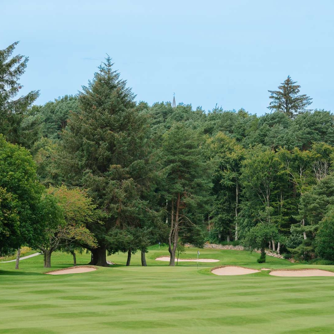 Tree-lined fairway and bunkers on the Haughton Course at Deeside Golf Club