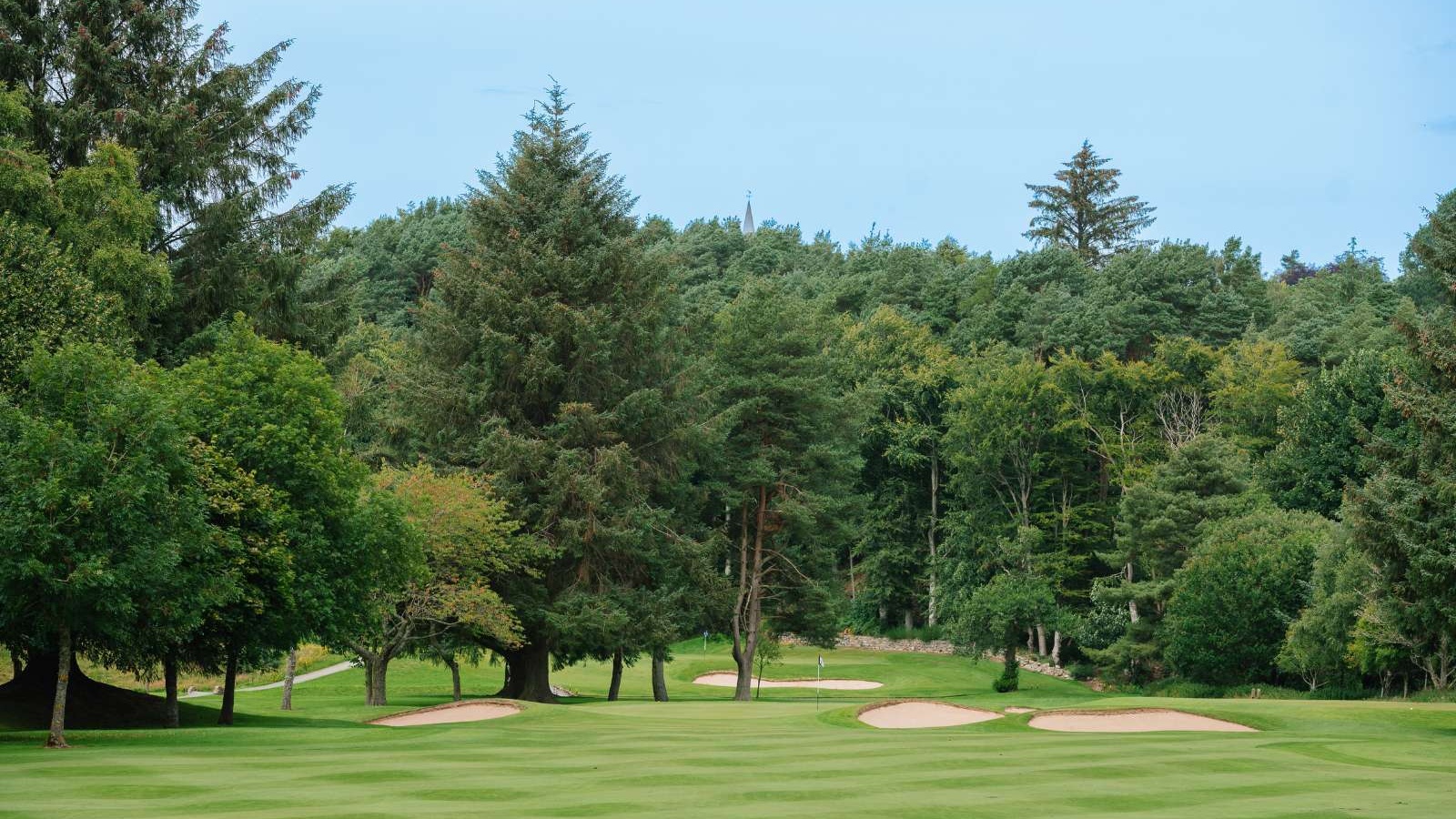 Tree-lined fairway and bunkers on the Haughton Course at Deeside Golf Club