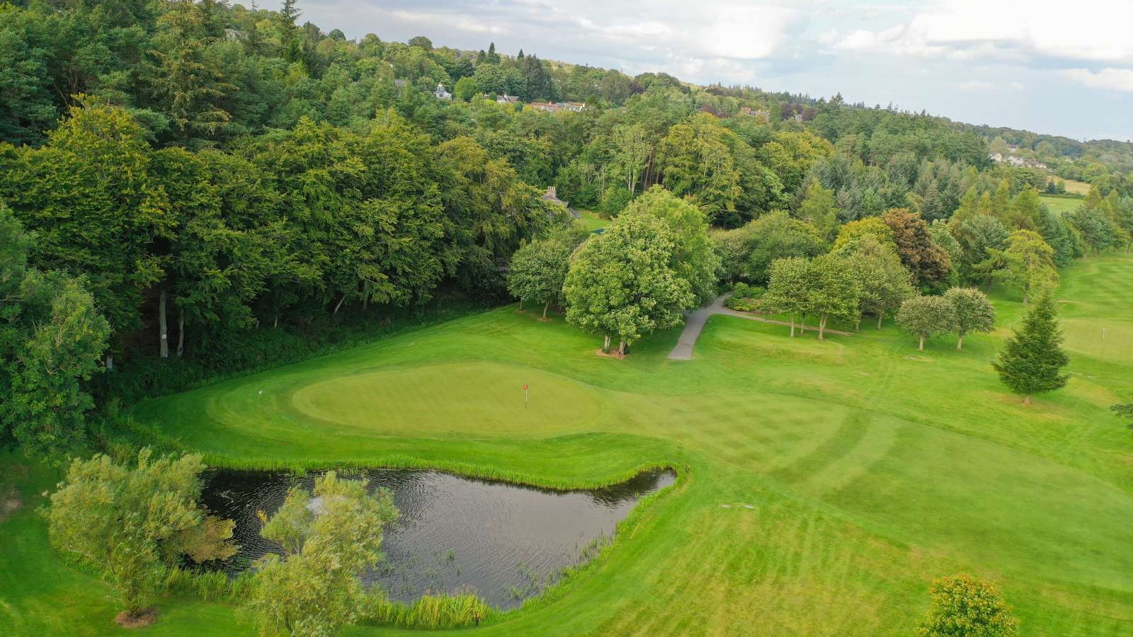 Golf green and fairway beside the River Dee on the Haughton Course at Deeside Golf Club