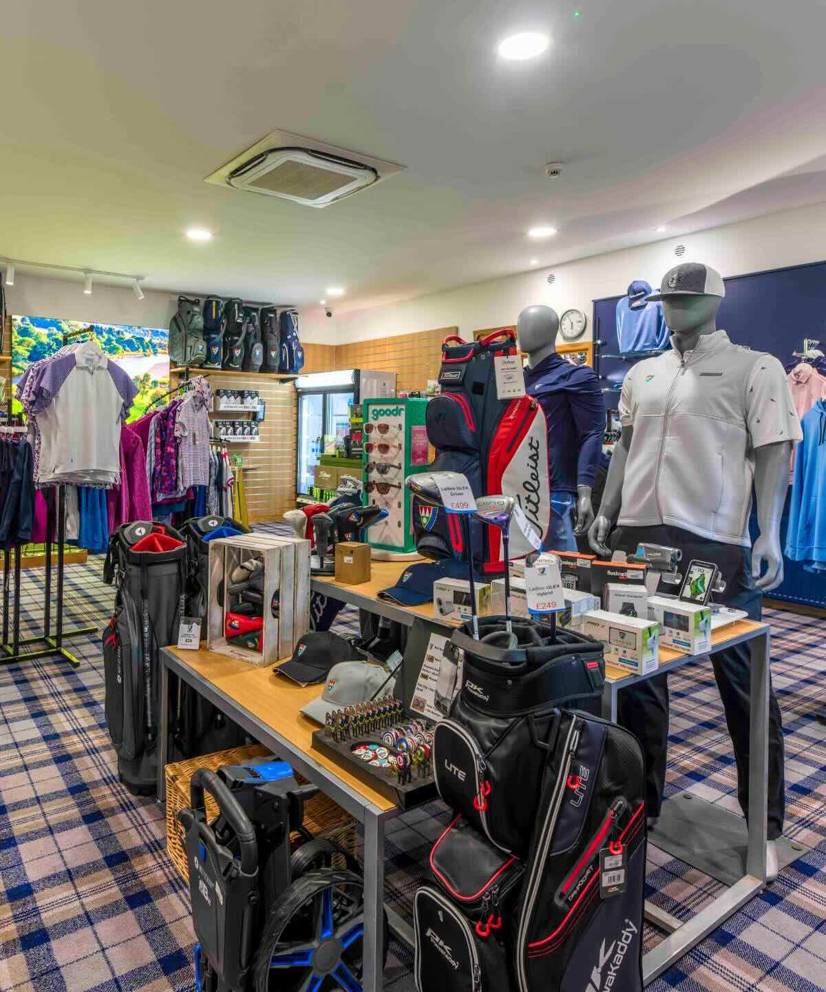 Inside the Pro Shop at Deeside Golf Club with golf bags, clothing, clubs and accessories