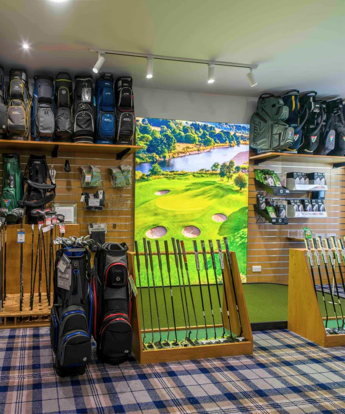 Golf putters, gloves and golf bags displayed inside the Deeside Golf Club Pro Shop